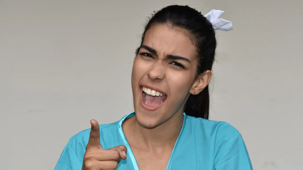 A rude nurse yelling and pointing